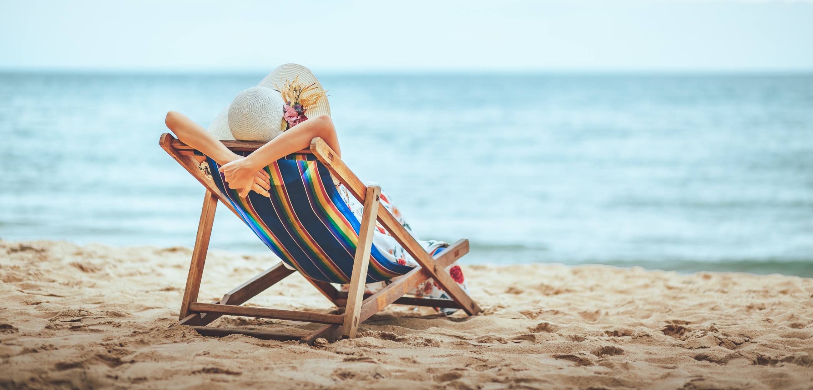 5-Safest-Places-for-Solo-Travel-lady-relaxing-on-a-chair-on-the-beach