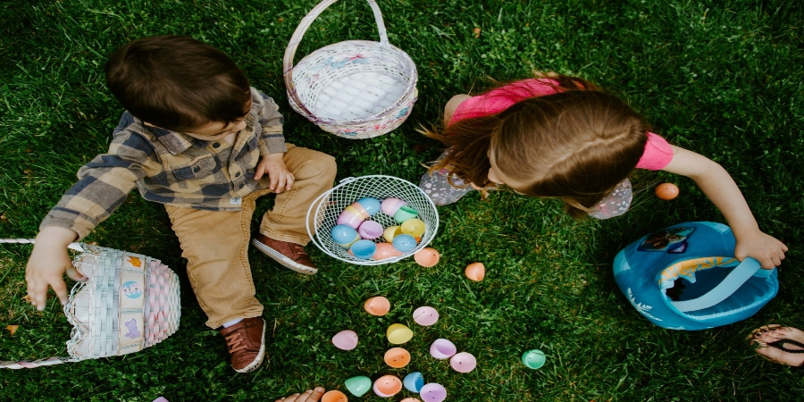 Vibrant Easter festivities unfold as children joyfully engage in egg hunts, laughter echoing through the air.