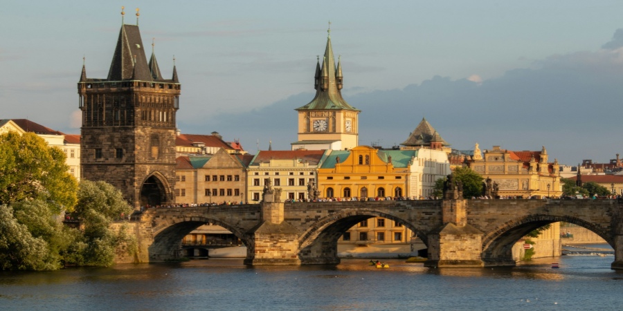 Stunning Prague bridge with historic backdrop: Captivating view capturing the charm and beauty of this iconic European cityscape.